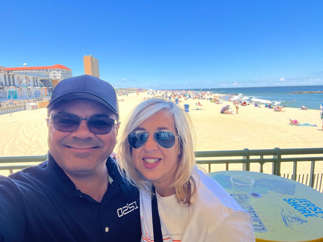 Gil and his wife on the boardwalk above the beach at Asbury Park, New Jersey