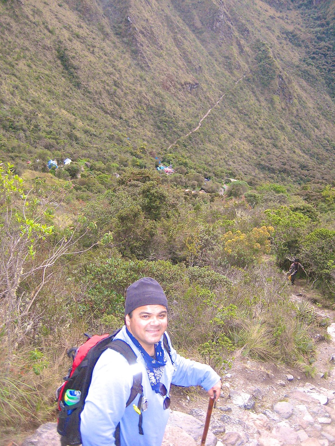 Gil on the Inca Trail with the trail and camp in the valley far below